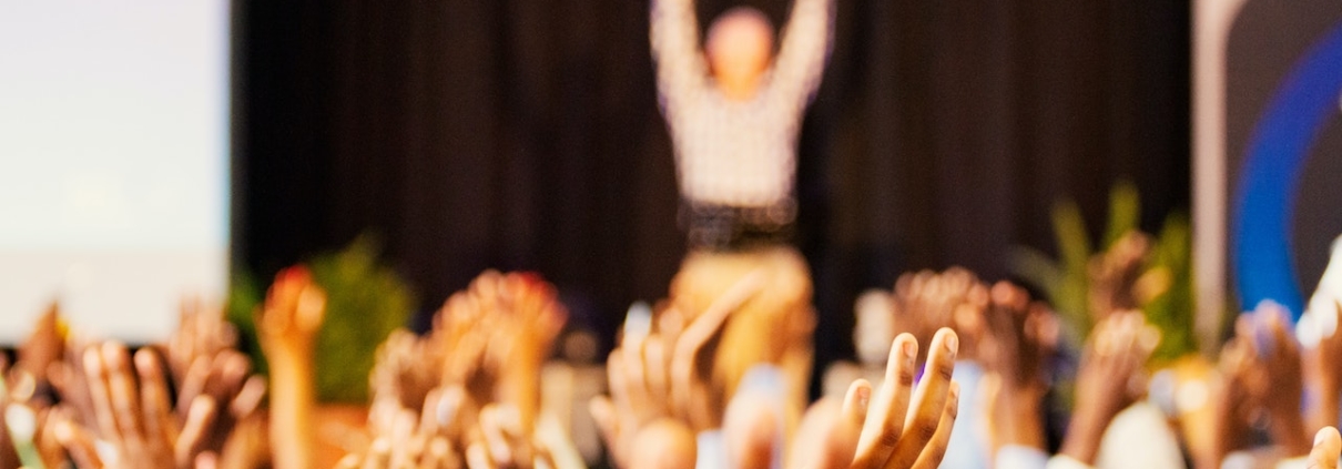 Hands raised at AGM meeting for Sea to Sky Hospice Society